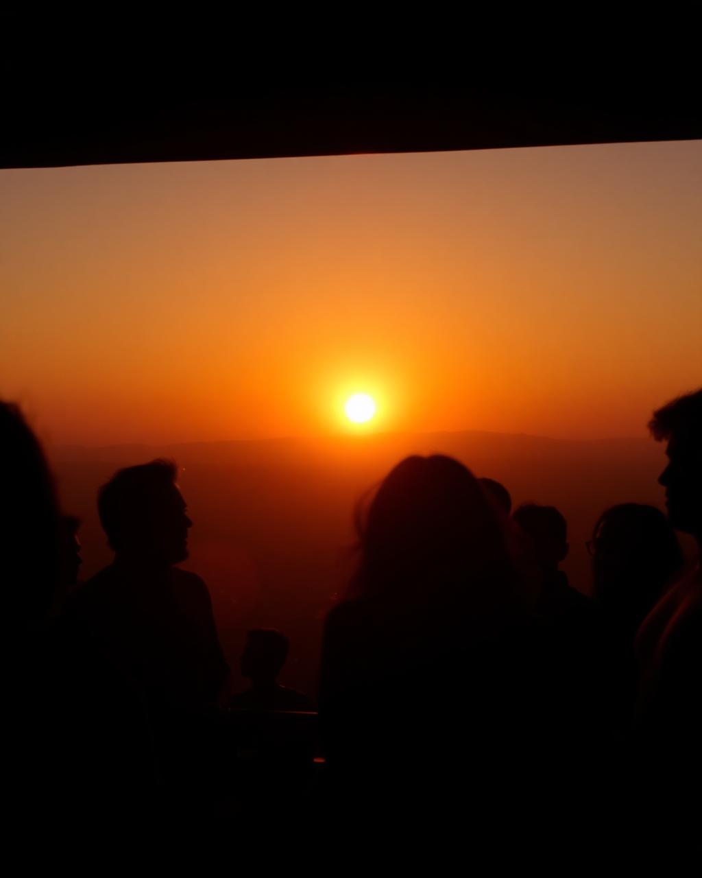 Silhouettes at amber sunset afterparty